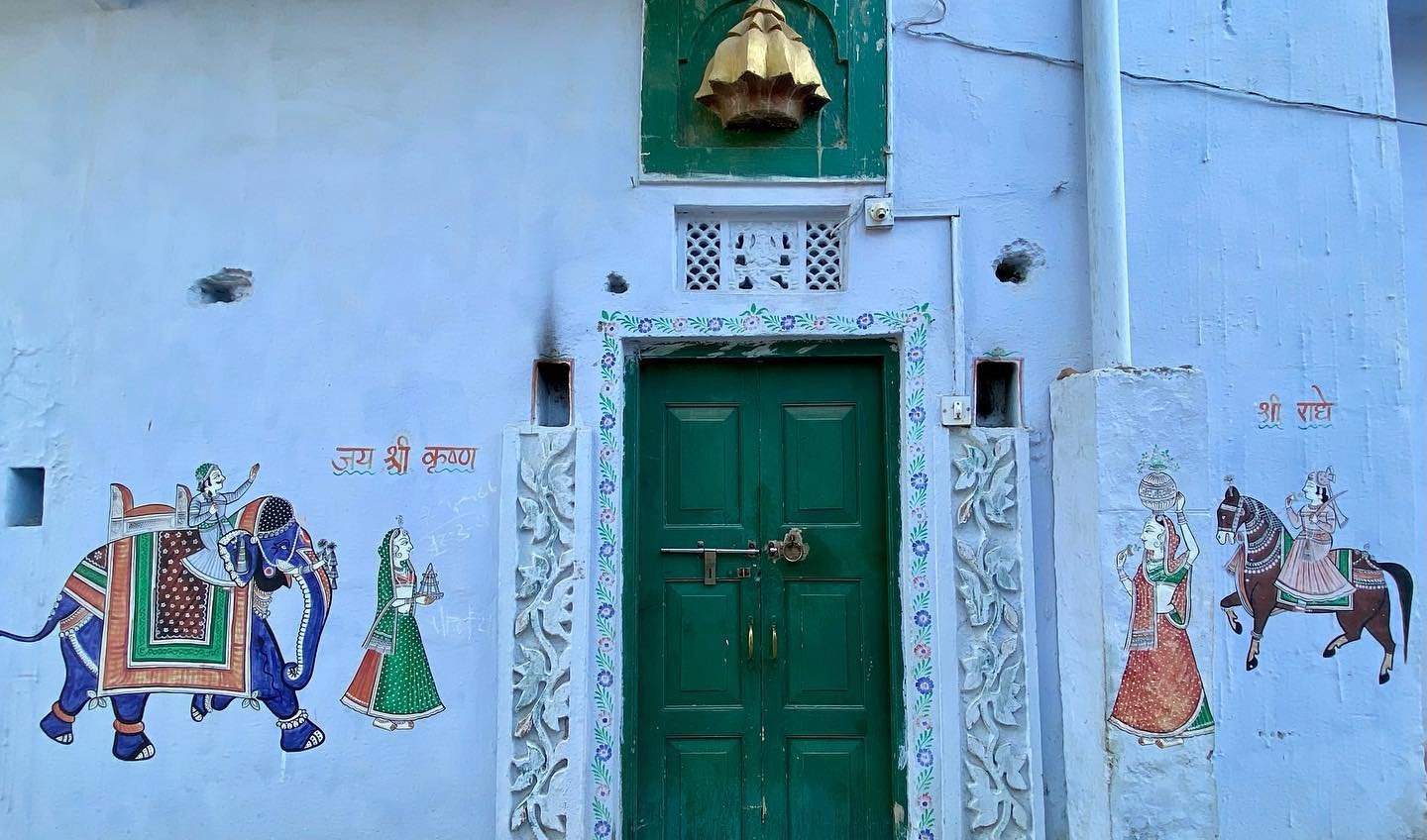 Wall paintings on the exterior of a home in Chitrakaron ki gali, Nathdwara.